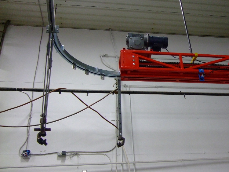 Orange Drive unit for trolley conveyor indexer with hooks
